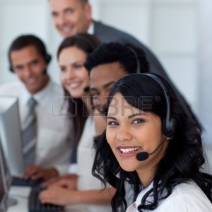 10073574-portrait-of-a-businesswoman-in-a-call-center-with-her-team